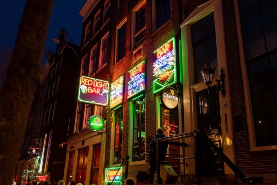 Amsterdam: Red Light District Tour in German/English/Italian - Walking from Dam Square into Amsterdam’s real contradictions