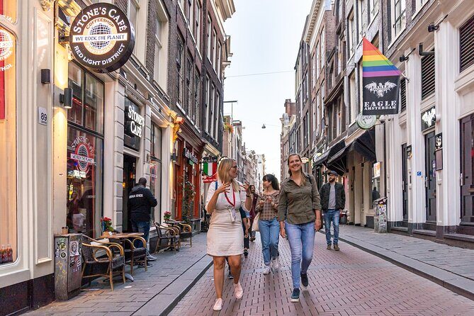 Amsterdam Red Light District Walking Tour in EN/DE/IT/ES - Beyond the Windows: Safety, Pimps, and What the City Tries to Do