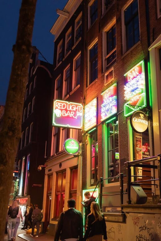 Amsterdam: Red Light Tour Exclusive + Peep Show - Condomerie and Oude Kerk: the city’s contrast game, up close