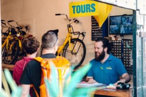 Amsterdam: Relaxed City Highlights Guided Bike Tour - Getting to Nieuwezijds Kolk and Yellow Bike Tours near Central Station