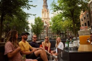 Amsterdam: Saloon Boat Cruise + Unlimited Drinks & Bite option - Zuiderkerk and the Stopera: the skyline, up close