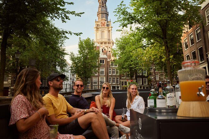 Amsterdam: Saloon Boat Cruise + Unlimited Drinks & Bite option - Zuiderkerk and the Stopera: the skyline, up close