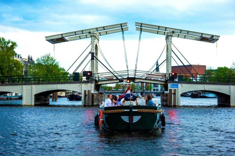 Amsterdam: The Newest Canal Cruise with Drink Option - Inside the electric boat: open views, covered comfort
