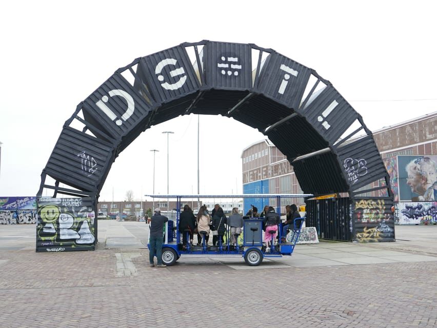 Amsterdam: The Original BUBBLES & BIKE Private Prosecco Tour - Getting to Rhôneweg 1 under the train viaduct