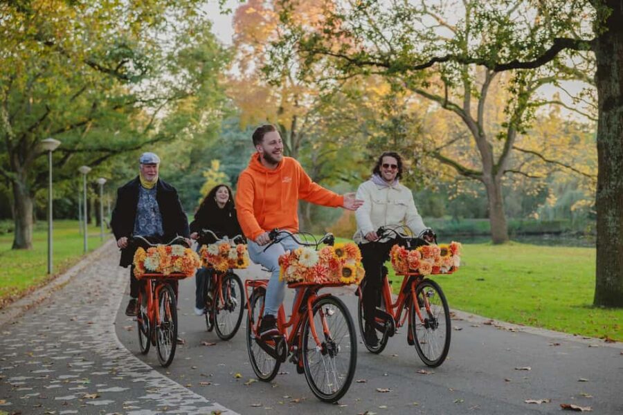 Amsterdam: Top Highlights Guided Bike Tour EN/DE/ES/FR/IT/CN - Stop-by-Stop Route: From Jordaan Lanes to the Canal Belt
