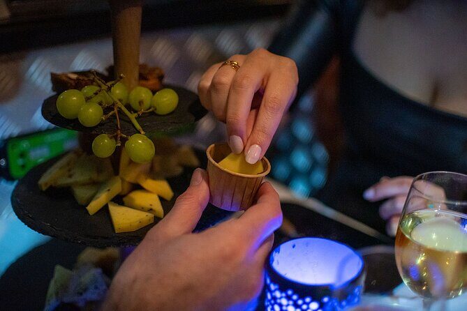 Amsterdam Wine and Cheese Guided Evening Cruise - Passing landmark areas: Red Light District, Westerkerk, and more