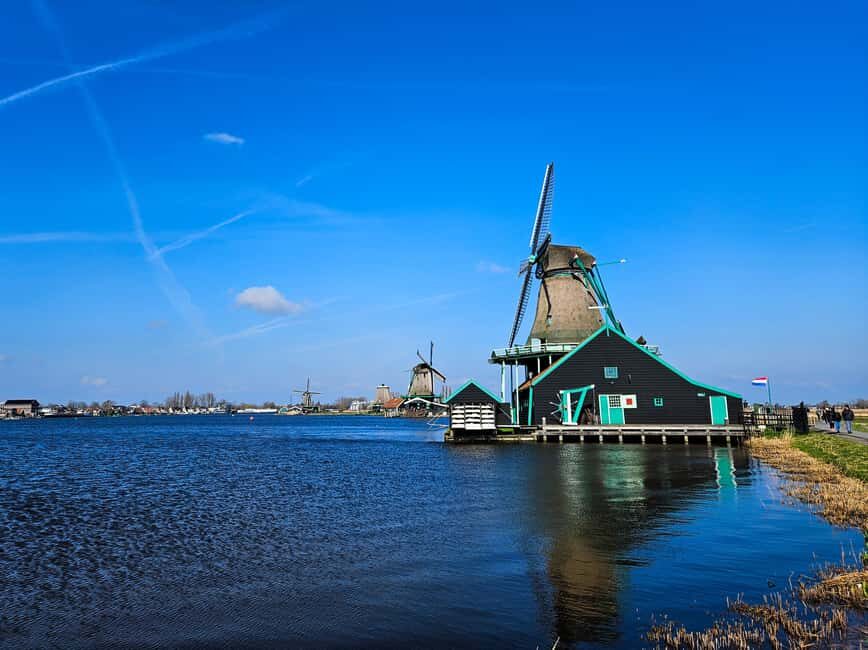 Amsterdam: Zaanse Schans windmills & Volendam Guided Tour - Volendam’s fishing-village feel: churches, harbor life, and the dike view