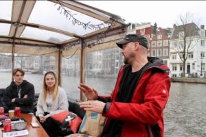 Dutch Cheese & Drinks Guided Amsterdam Boat Tour, All Inclusive - Oude Kerk and the Red Light District: history you can actually picture
