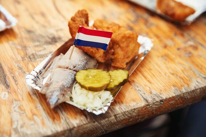 Eating Amsterdam: Albert Cuyp Market & The Pijp Food Tour - Simon Meijssen and the saucijzenbroodje you can recognize instantly