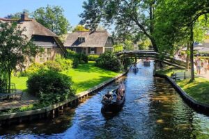 Giethoorn Day Tour from Amsterdam with Small Boat Ride - Getting there from Amsterdam: the van ride is part of the experience