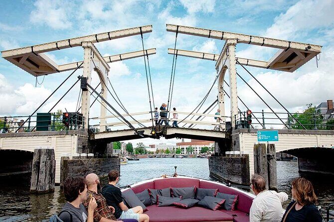 Guided Amsterdam Canal Cruise – Snacks & Drinks on board(1 Hour) - From East India Company Beginnings to a Ship-Shaped Landmark
