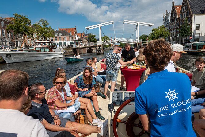 Haarlem Open-Boat Canal Cruise with Live Guide (Electric Boat) - Live English guidance: stories, questions, and real names you might hear