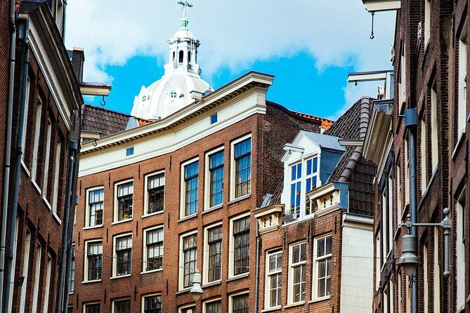 Private City Kickstart Tour: Amsterdam - St. Nicholas Church, Chinatown mood, and Bloemenmarkt for real senses