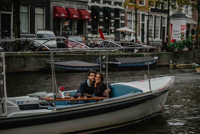 Private Romantic Canal Cruise Amsterdam with Bubbly and Snacks - Seven bridges, the Skinny Bridge tradition, and kissing at the right moment
