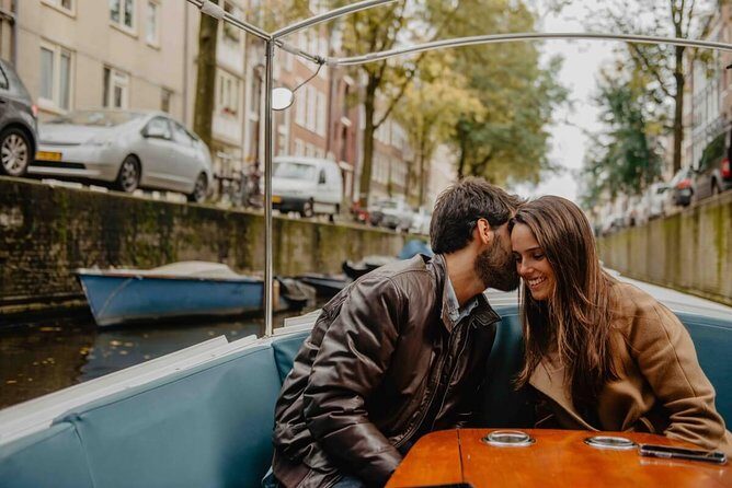 Private Romantic Canal Cruise Amsterdam with Bubbly and Snacks - Amstel views: circus theatre, iconic bridges, and open river sightlines