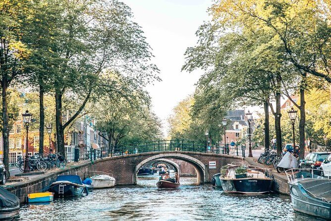 Private Romantic Canal Cruise Amsterdam with Bubbly and Snacks - Smallest house, inner canals, and the “Bridge of Love” stop