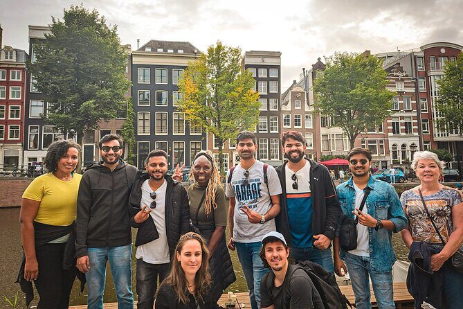 Small Group Walking Tour - Hello Amsterdam - Damrak near the Red Light District: learn the culture using a game